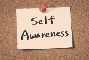 Noticeboard with a note highlighting self-awareness in leadership