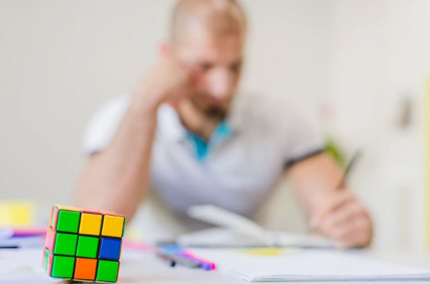 Person writing on the notebook